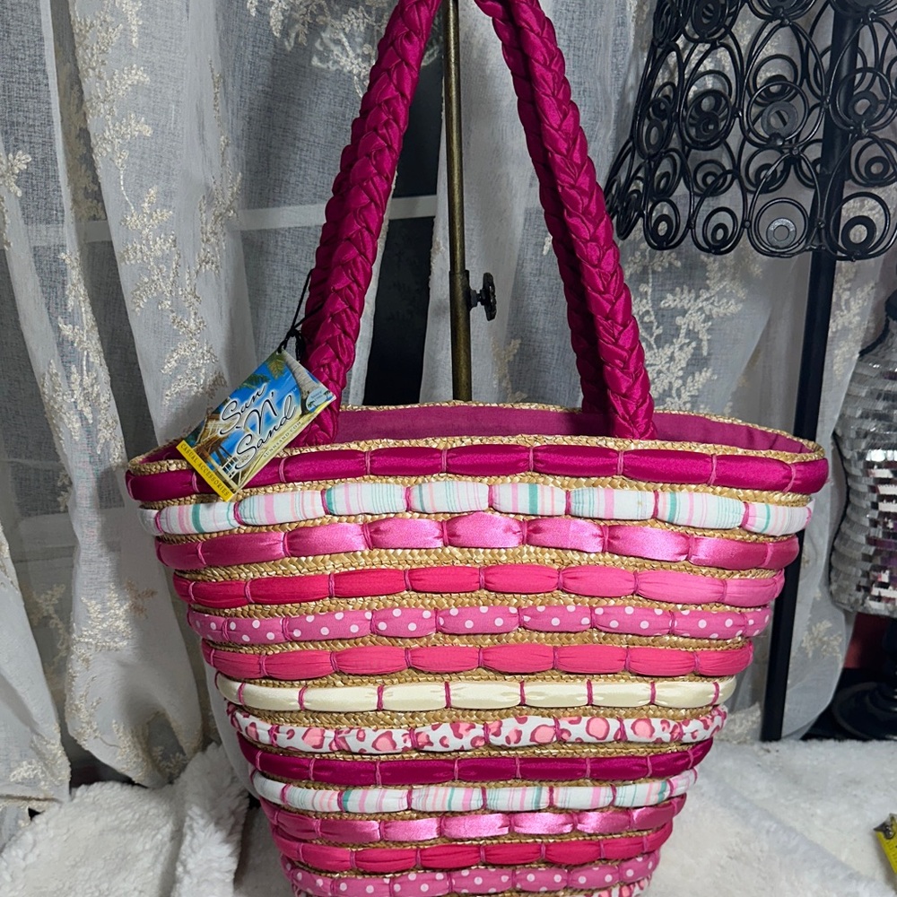 Sun and sand cloth and wicker tote bag